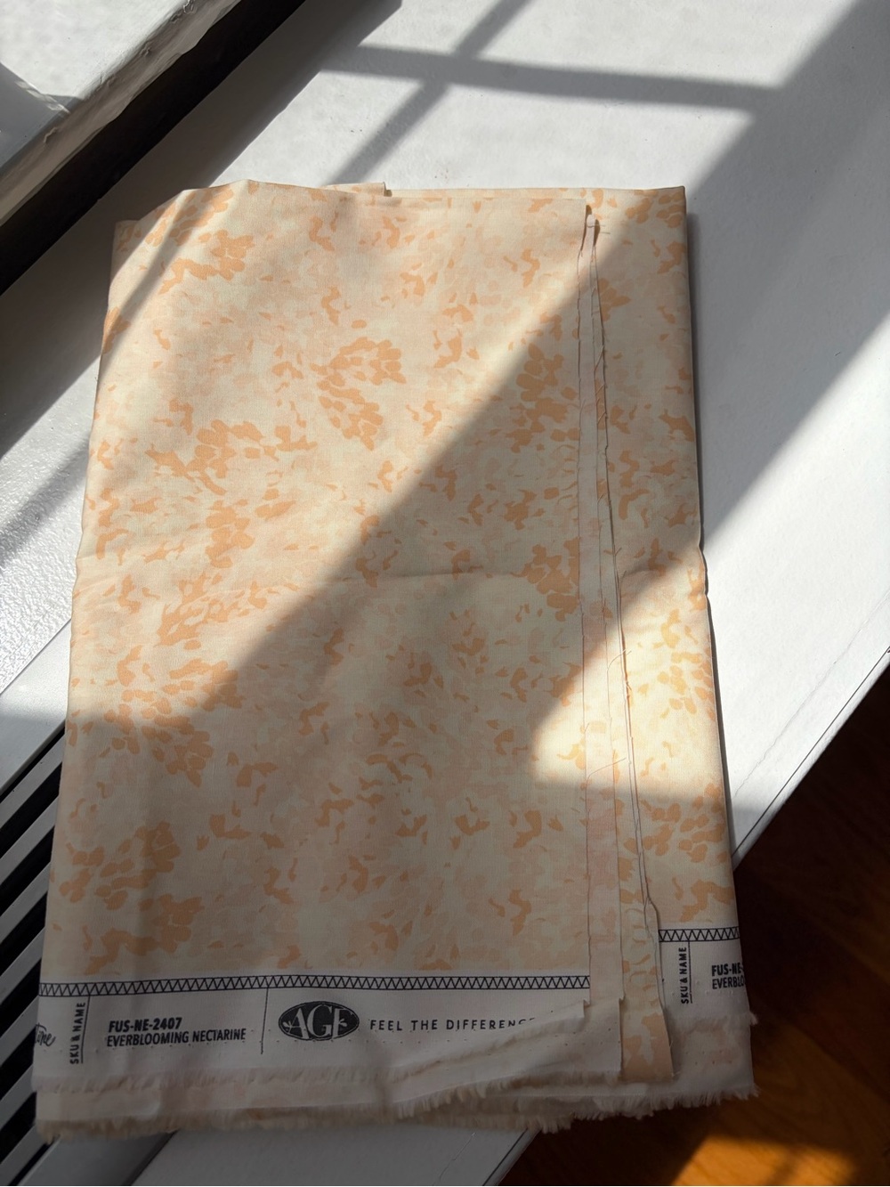 AGB EverBlooming Nectarine Floral Sheet Fabric in Peach and Cream